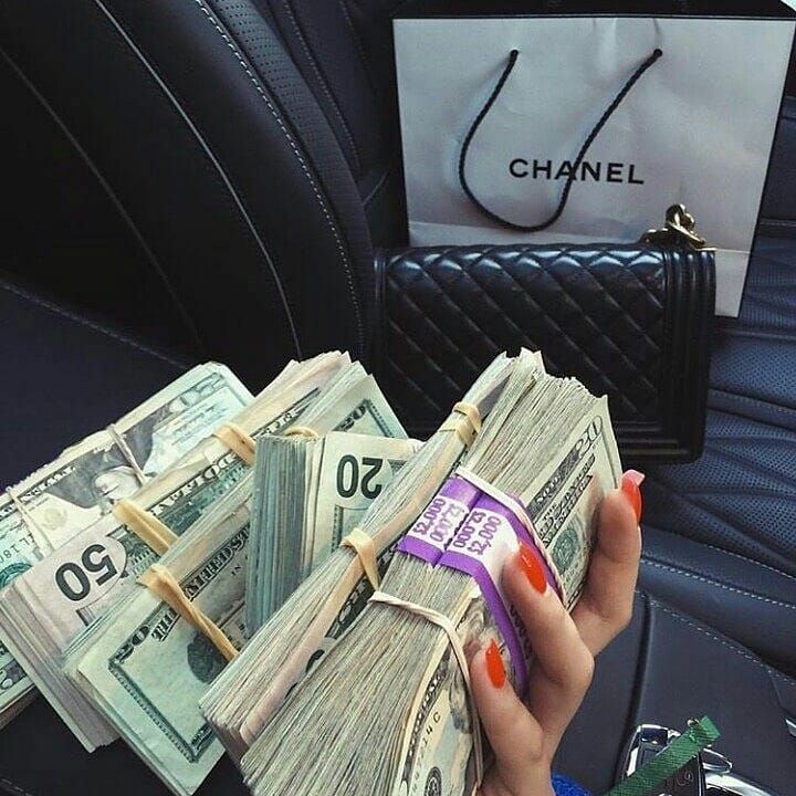 Girl holding lots of money